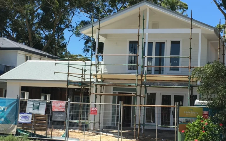 a house under construction with scaffolding