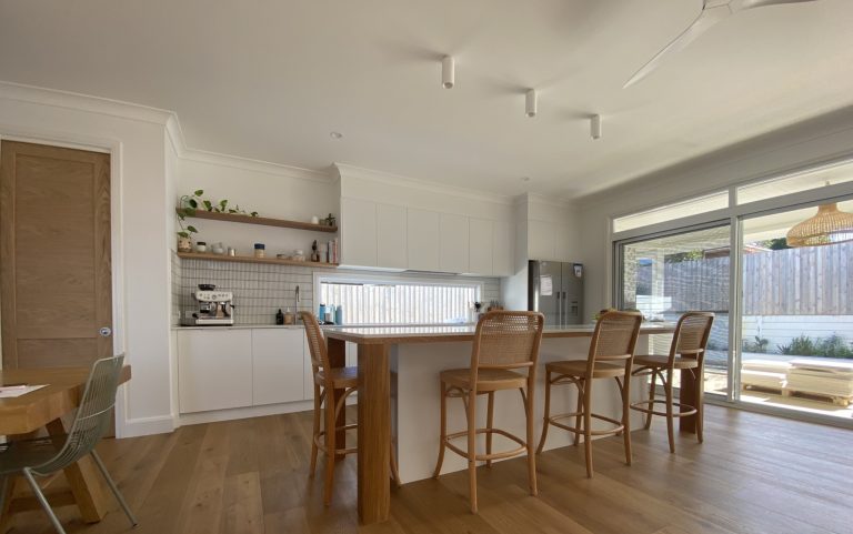 a kitchen with a table and chairs