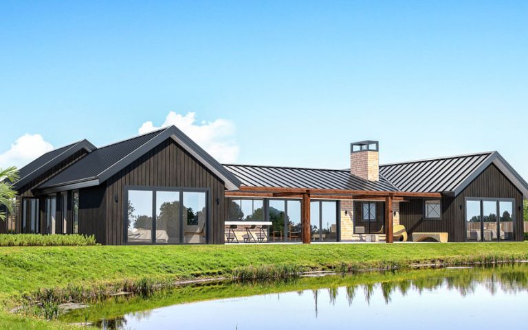 a house with a pond and grass